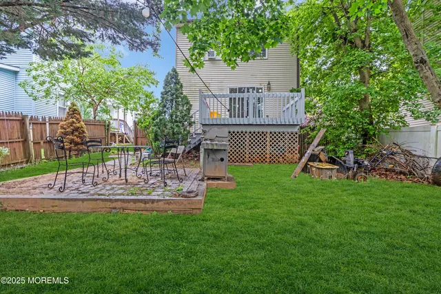 a view of a house with backyard and a slide