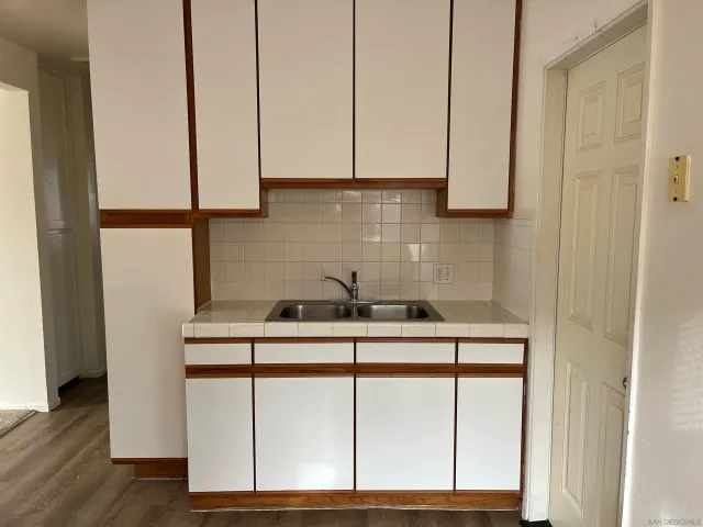 a kitchen with stainless steel appliances a sink and cabinets