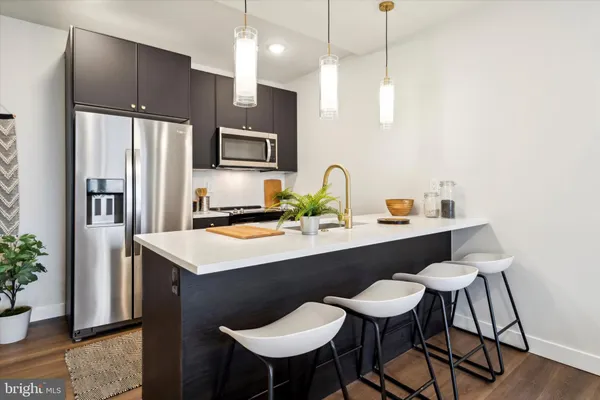 a kitchen with a table and chairs in it