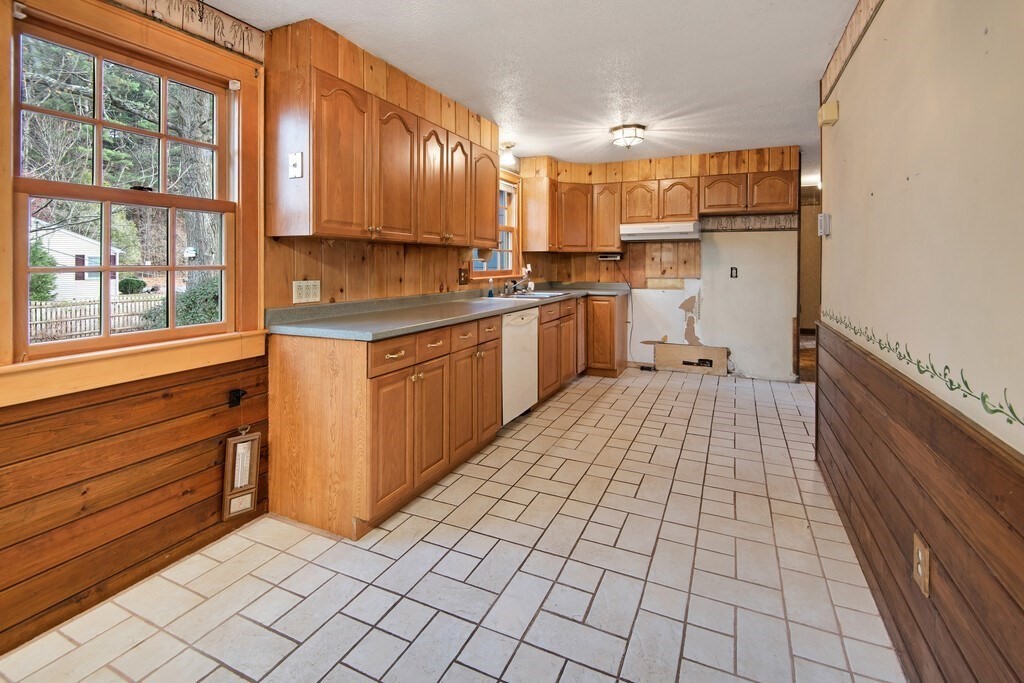 11 Beech Street Oxford, MA 01540 - Photo 14 of 40 a kitchen with stainless steel appliances a refrigerator and window