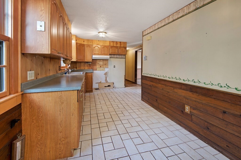 11 Beech Street Oxford, MA 01540 - Photo 15 of 40 a kitchen with stainless steel appliances a sink stove and cabinets