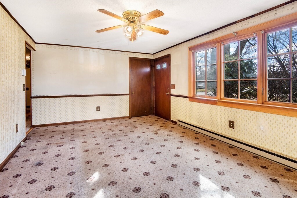 11 Beech Street Oxford, MA 01540 - Photo 19 of 40 a view of a big room with wooden floor and windows