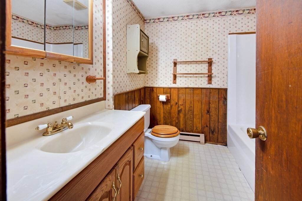 11 Beech Street Oxford, MA 01540 - Photo 26 of 40 a bathroom with a sink a toilet and shower