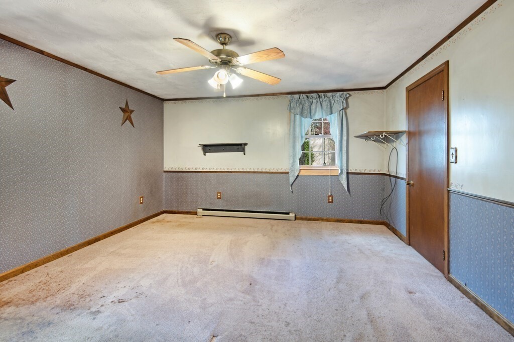 11 Beech Street Oxford, MA 01540 - Photo 29 of 40 a view of an empty room with a window