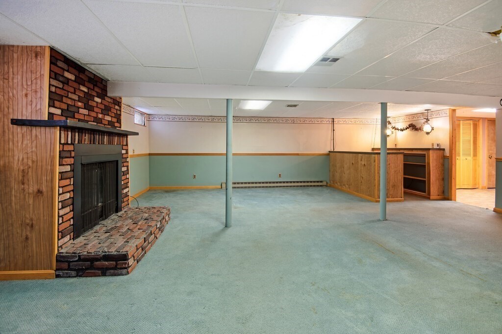 11 Beech Street Oxford, MA 01540 - Photo 32 of 40 a living room with furniture and a fireplace