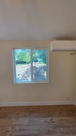 a view of a room that has a window in it