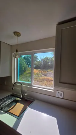 a room with furniture and a large window