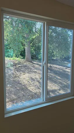 a view of a room with a large window