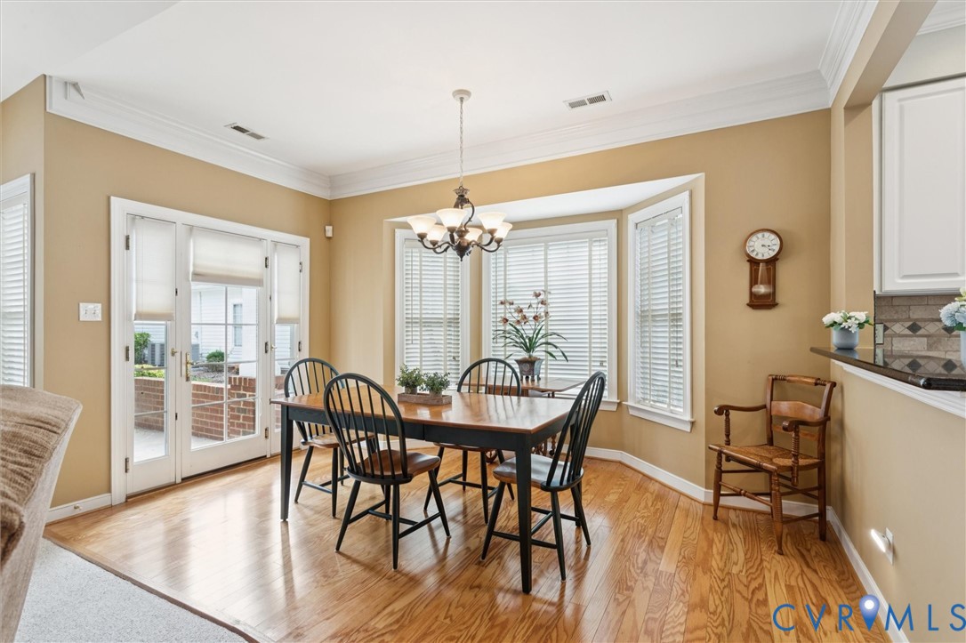 3143 Cider House Road Toano, VA 23168 - Photo 17 of 50 Dining room with crown molding, light wood-style f