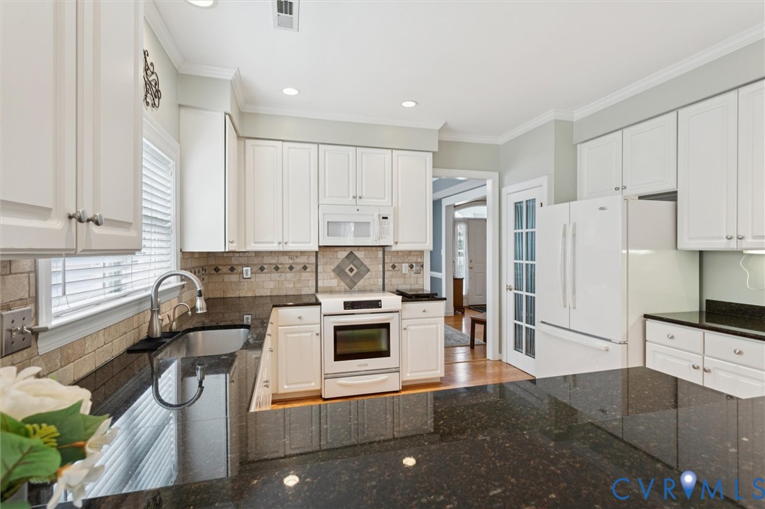 3143 Cider House Road Toano, VA 23168 - Photo 18 of 50 Kitchen featuring white appliances, white cabinetr