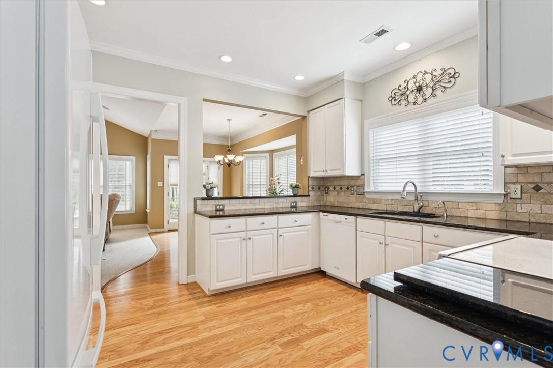 3143 Cider House Road Toano, VA 23168 - Photo 20 of 50 Kitchen with crown molding, light wood-style floor