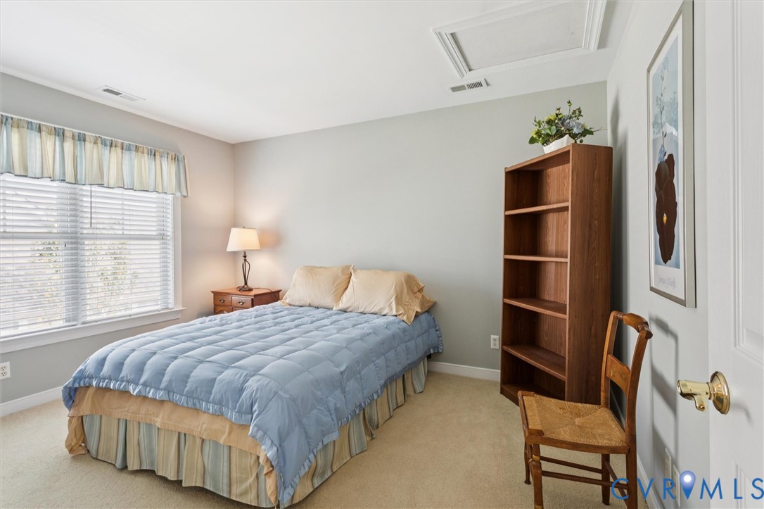 3143 Cider House Road Toano, VA 23168 - Photo 36 of 50 Bedroom featuring light carpet and attic access