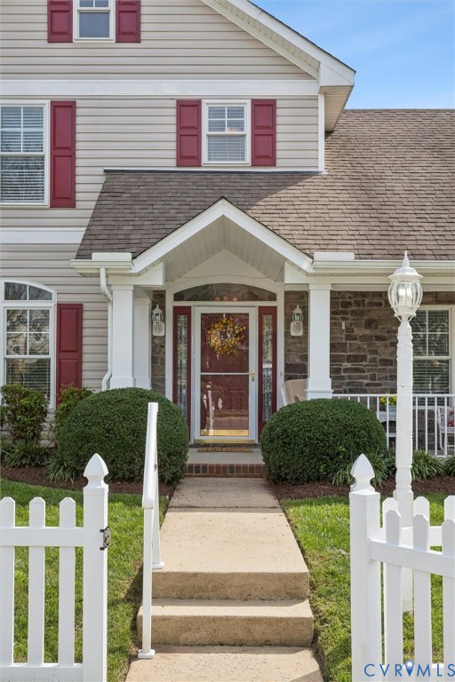 3143 Cider House Road Toano, VA 23168 - Photo 4 of 50 Property entrance with roof with shingles, covered