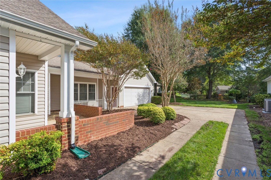 3143 Cider House Road Toano, VA 23168 - Photo 5 of 50 View of side of home featuring driveway, roof with