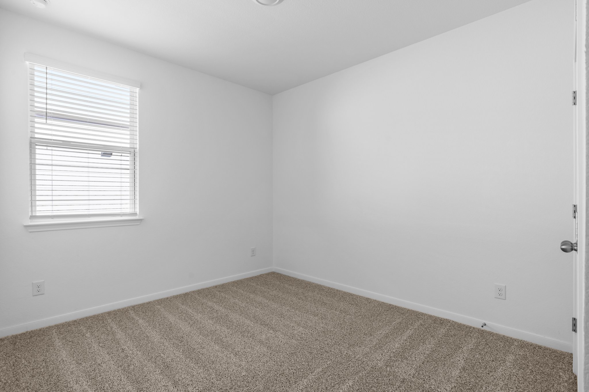 305 Brooks Ranch Drive Kyle, TX 78640 - Photo 24 of 32 an empty room with a window