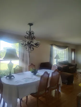 a kitchen with furniture and a stove