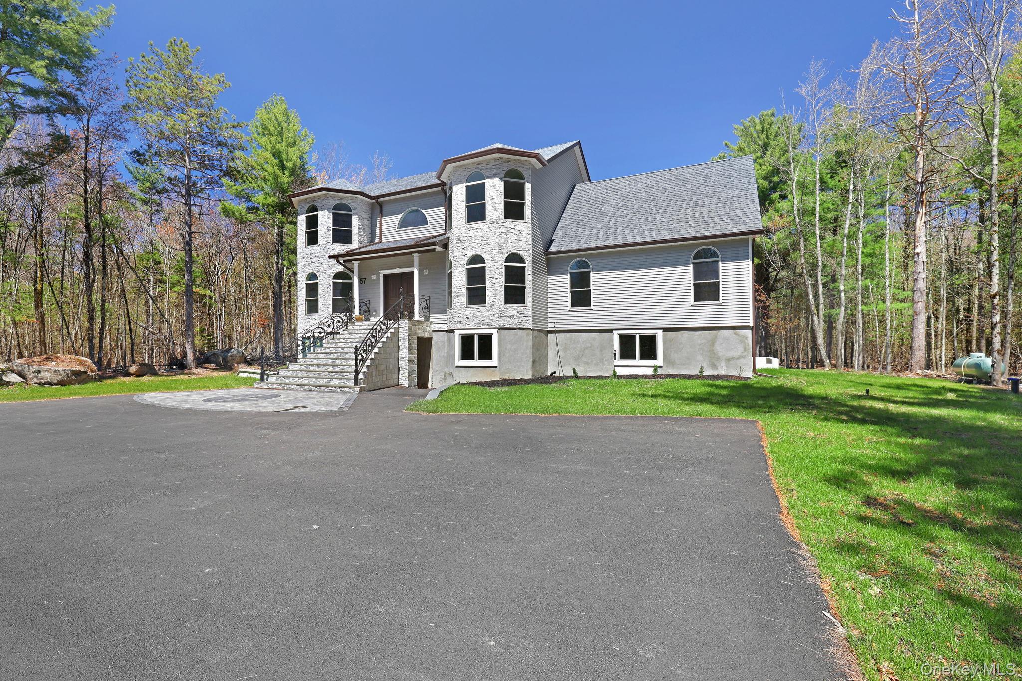 57 Haddock Road Monticello, NY 12701 - Photo 2 of 42 a house that has a lots of windows in it