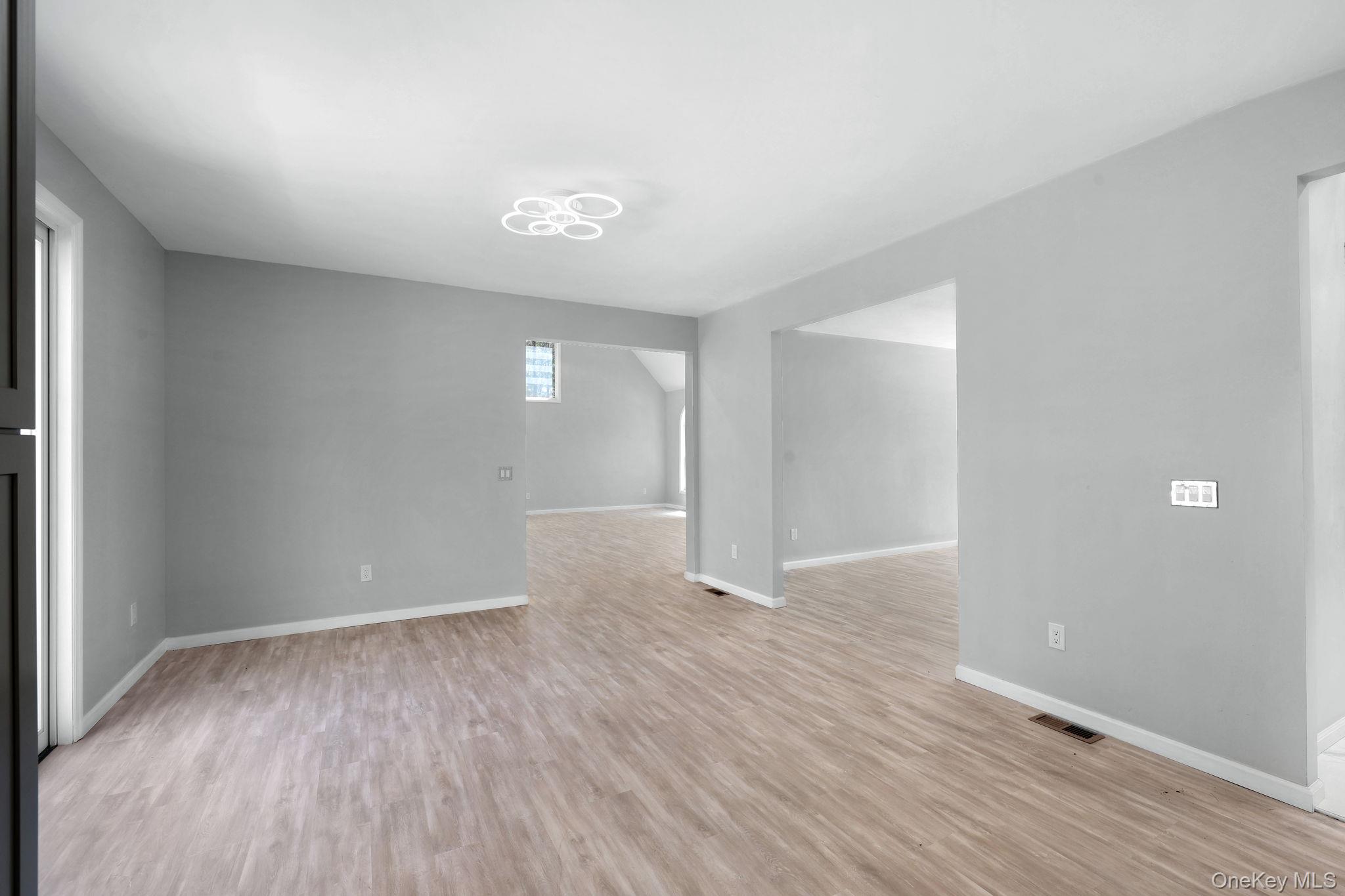 57 Haddock Road Monticello, NY 12701 - Photo 26 of 42 a view of an empty room with wooden floor