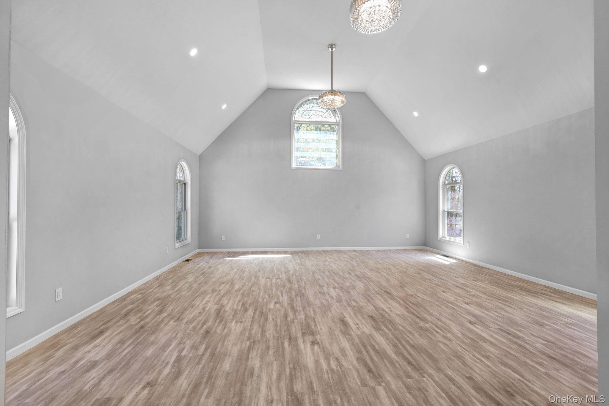 57 Haddock Road Monticello, NY 12701 - Photo 27 of 42 a view of an empty room with wooden floor and window