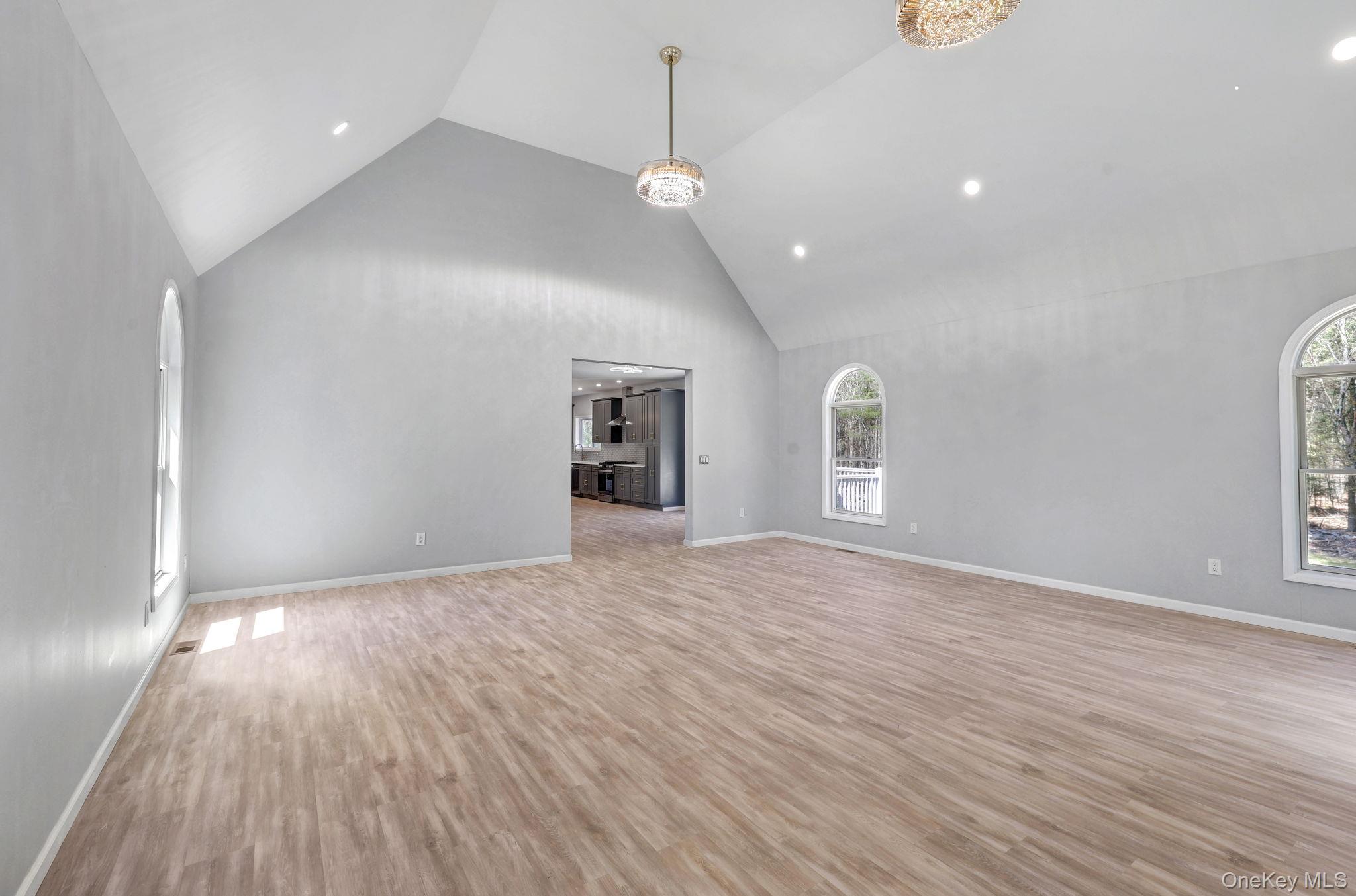57 Haddock Road Monticello, NY 12701 - Photo 28 of 42 a view of an empty room with wooden floor and a window