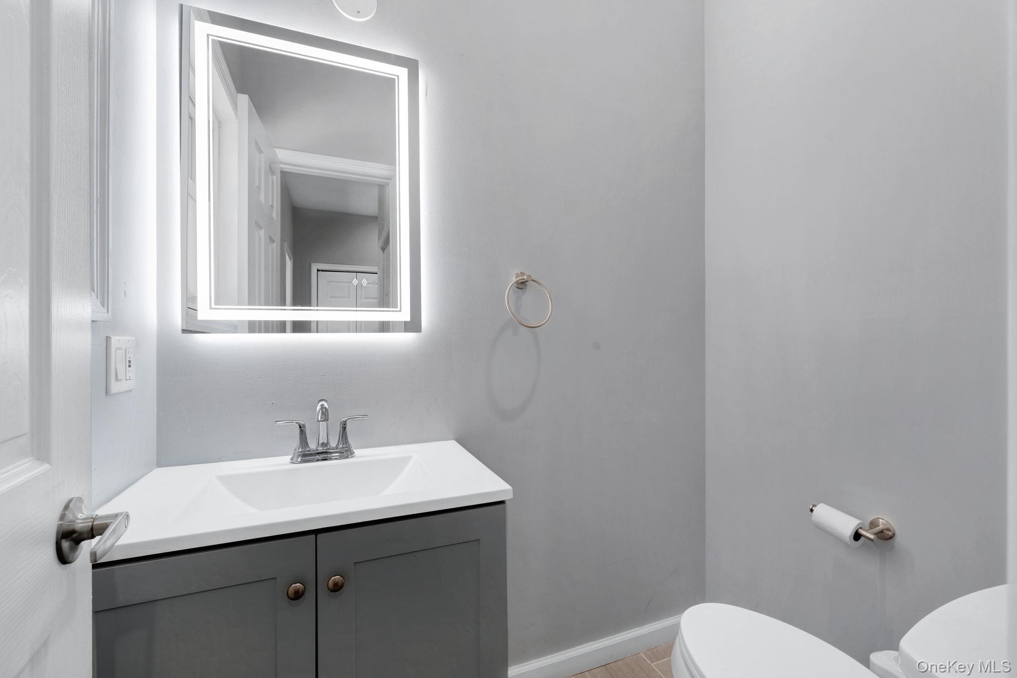 57 Haddock Road Monticello, NY 12701 - Photo 29 of 42 a bathroom with a sink a toilet and mirror