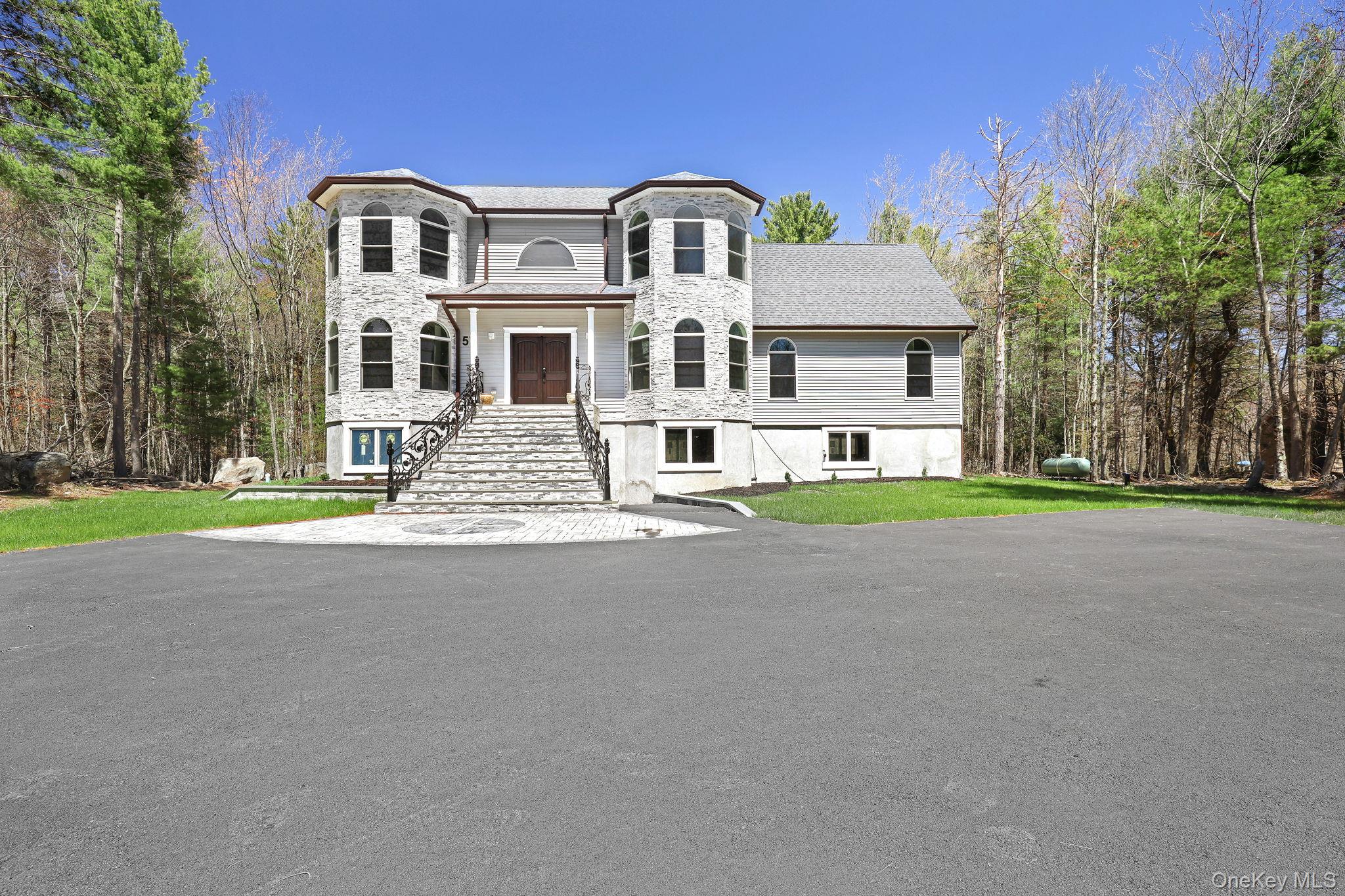 57 Haddock Road Monticello, NY 12701 - Photo 3 of 42 a front view of a house with a yard