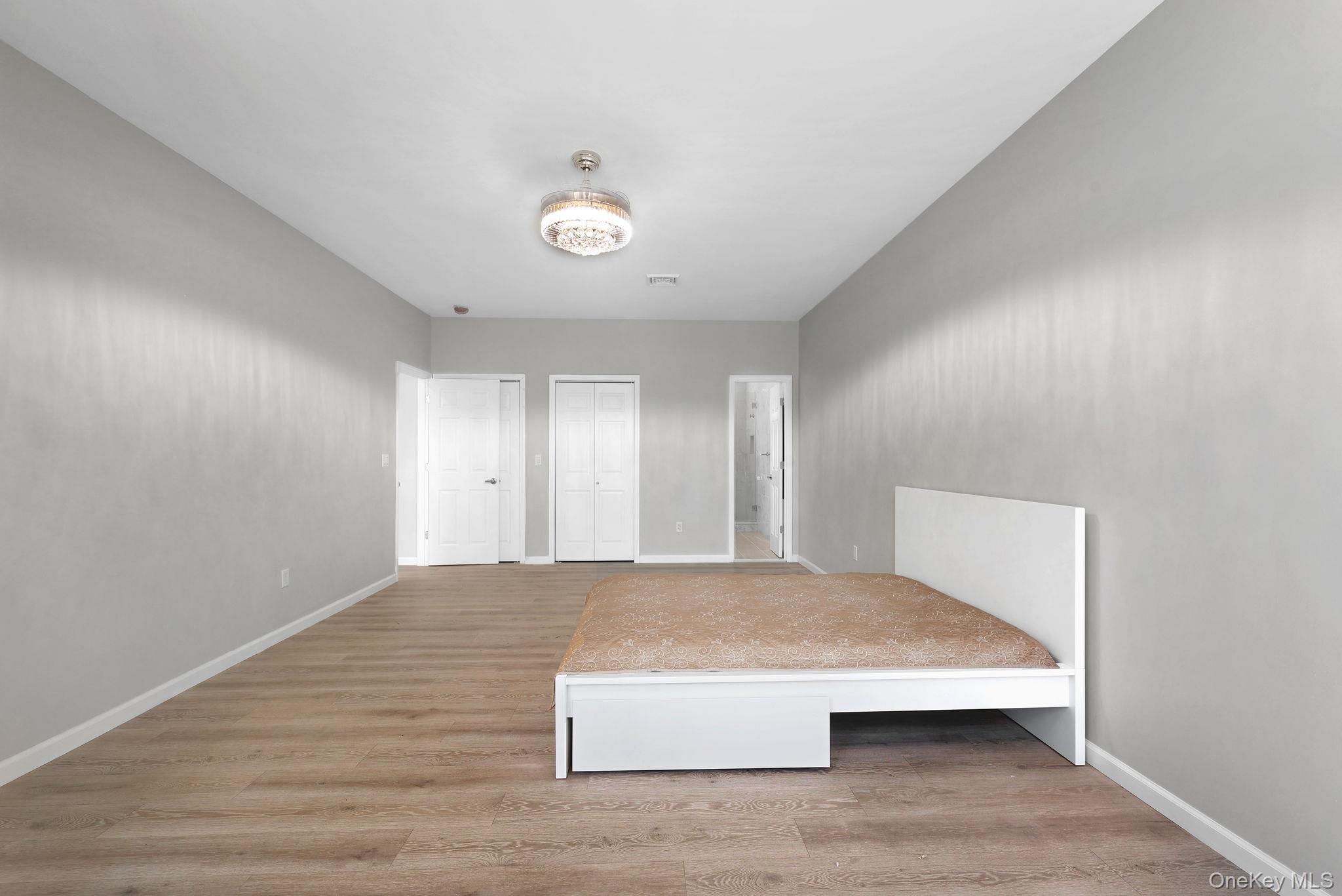 57 Haddock Road Monticello, NY 12701 - Photo 31 of 42 a view of a big room with wooden floor and windows