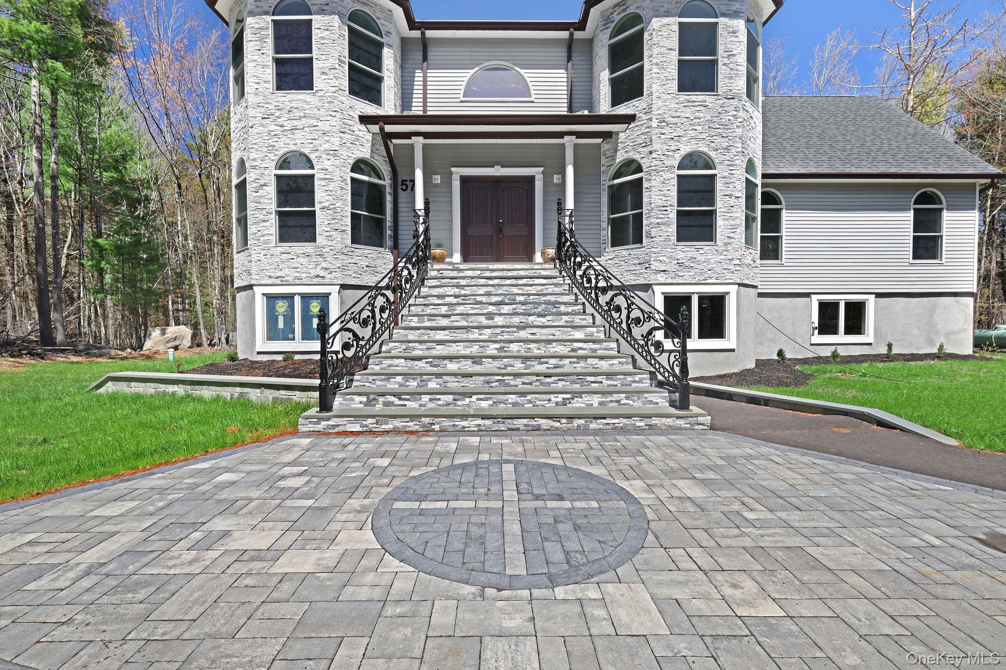 57 Haddock Road Monticello, NY 12701 - Photo 4 of 42 a view of a building with a yard