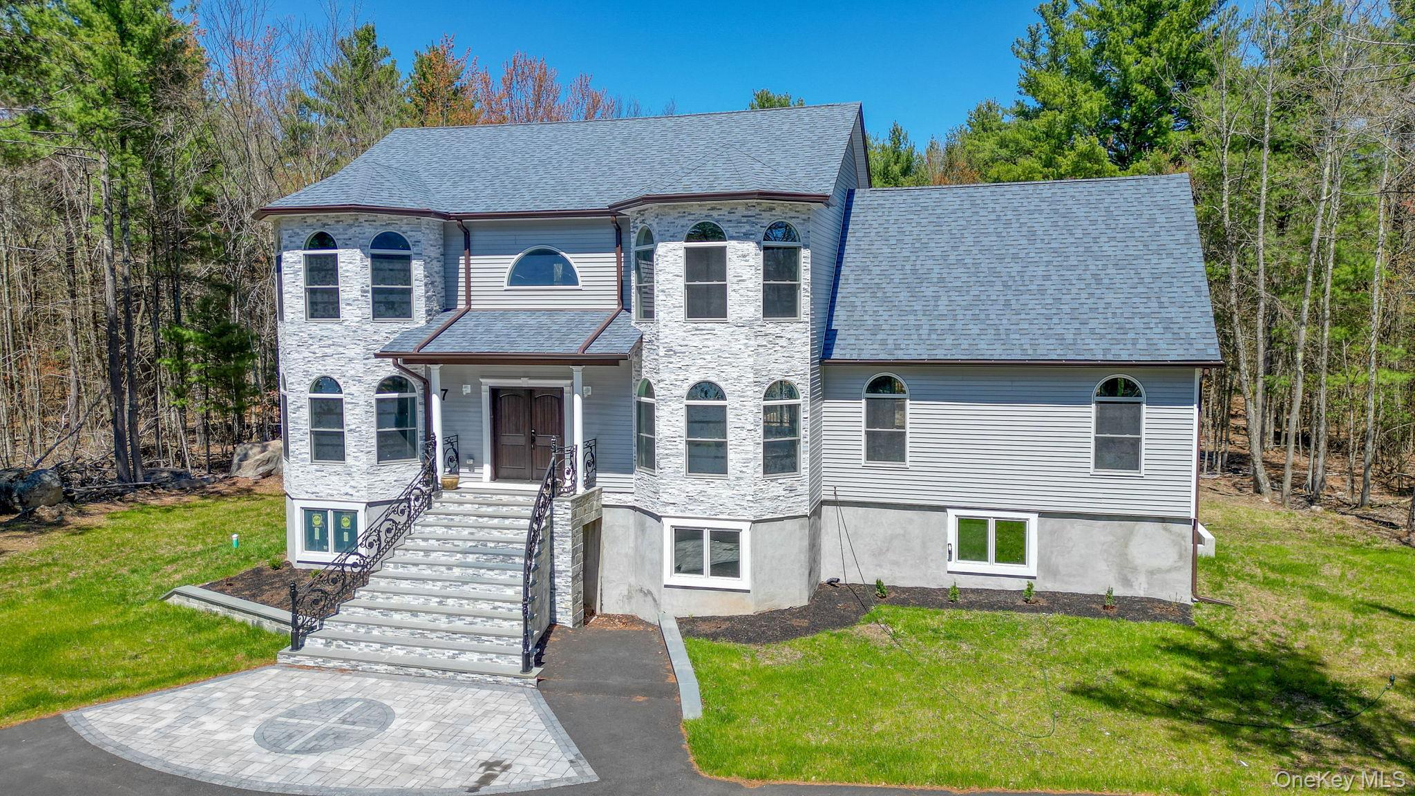 57 Haddock Road Monticello, NY 12701 - Photo 6 of 42 front view of a house with a yard