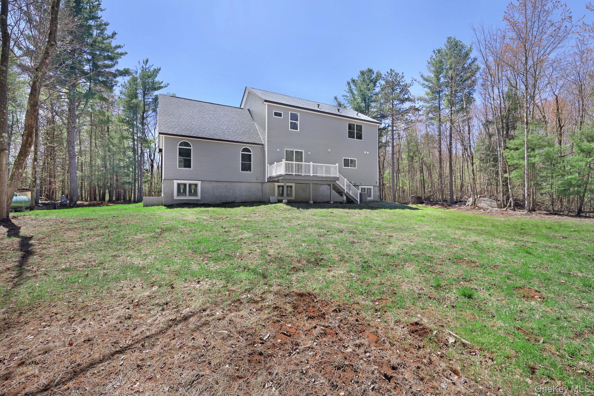57 Haddock Road Monticello, NY 12701 - Photo 7 of 42 a view of a house with a yard and garage