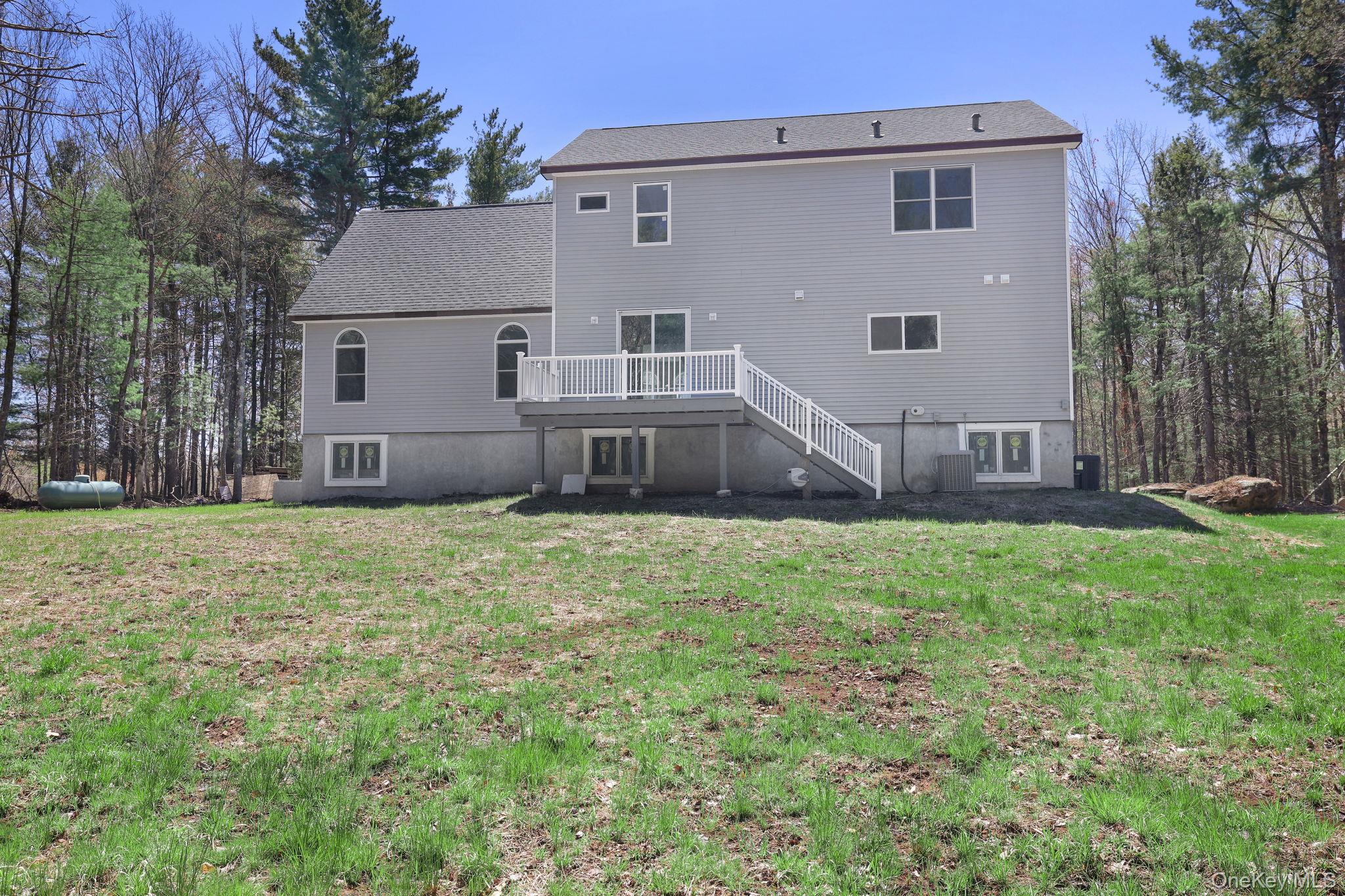 57 Haddock Road Monticello, NY 12701 - Photo 8 of 42 a view of a house with backyard and a tree