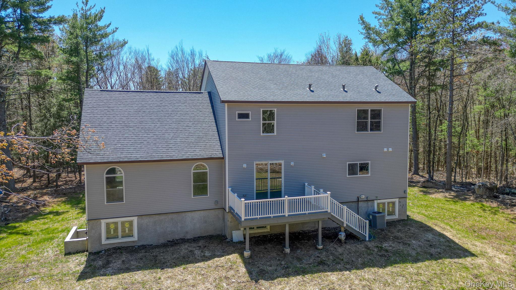 57 Haddock Road Monticello, NY 12701 - Photo 9 of 42 a backyard of a house with outdoor seating