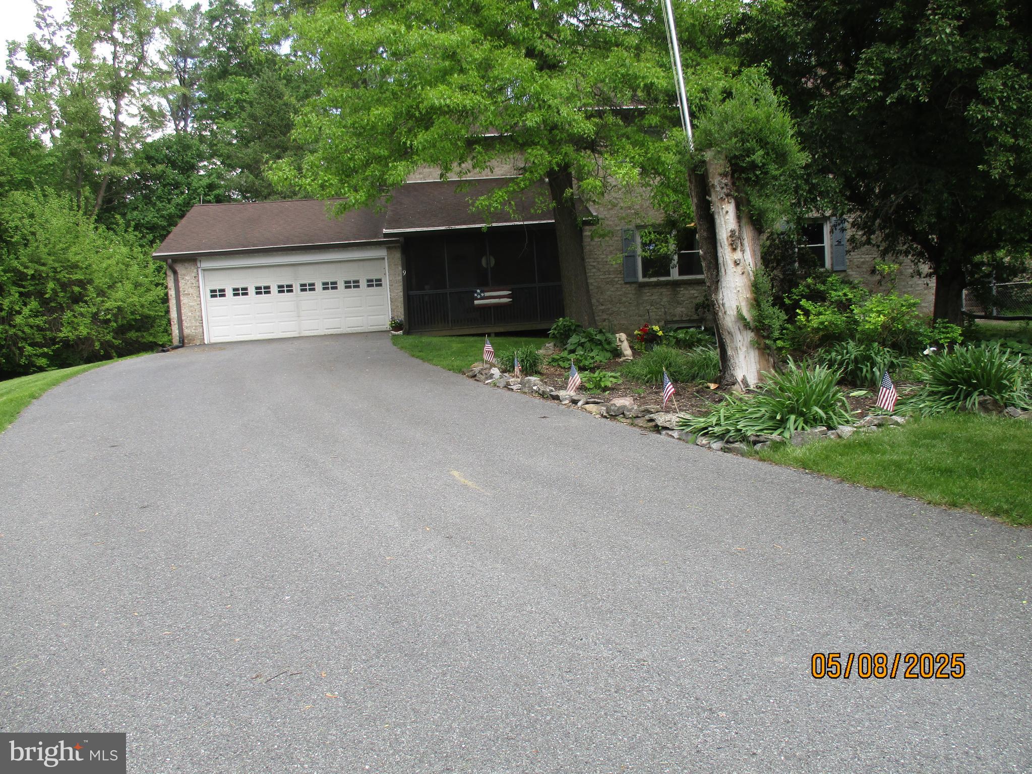9 Montsera Road Carlisle, PA 17015 - Photo 14 of 142 a view of a house with a yard and a garage