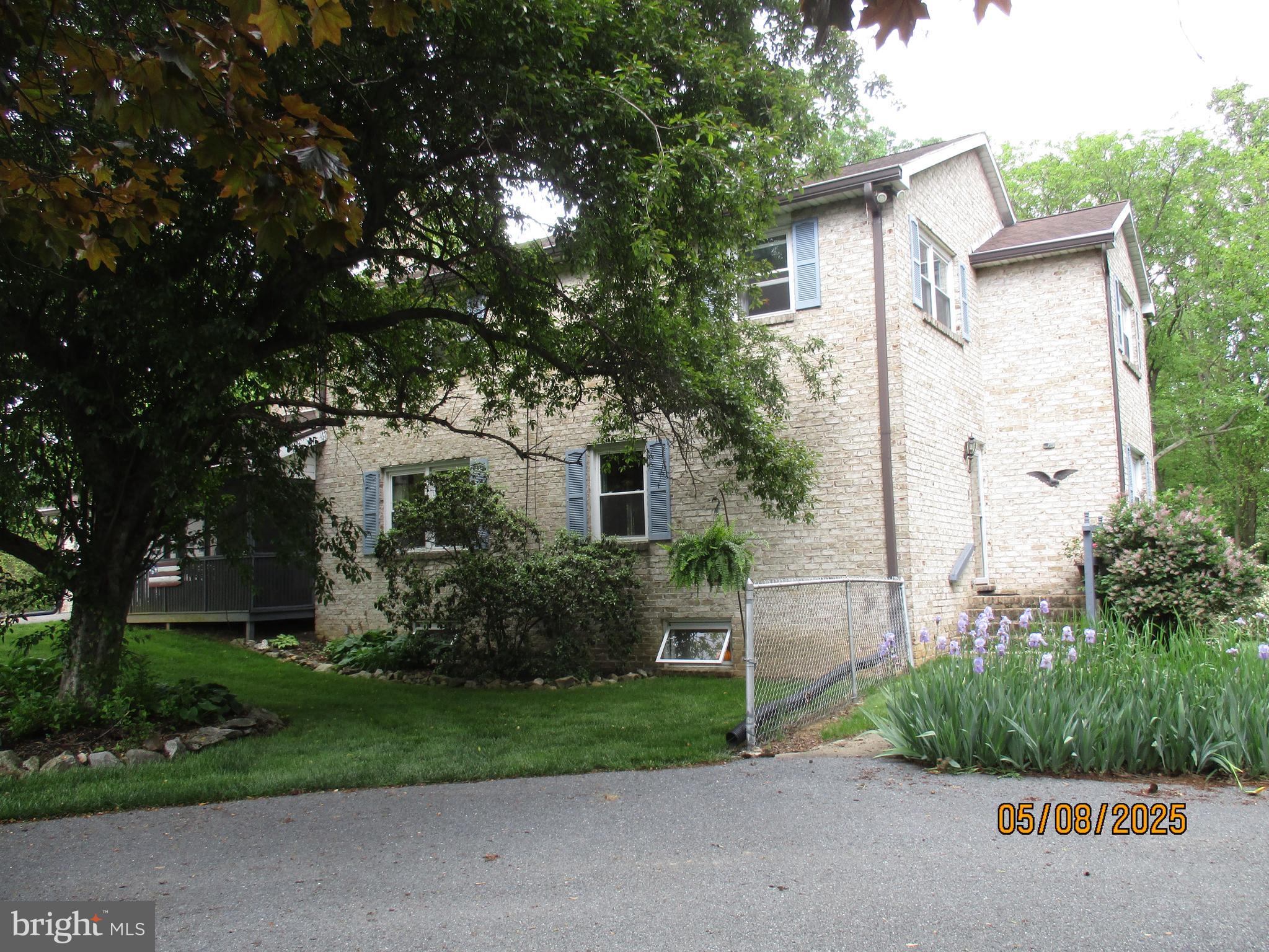 9 Montsera Road Carlisle, PA 17015 - Photo 3 of 142 front view of house with a yard and trees all around