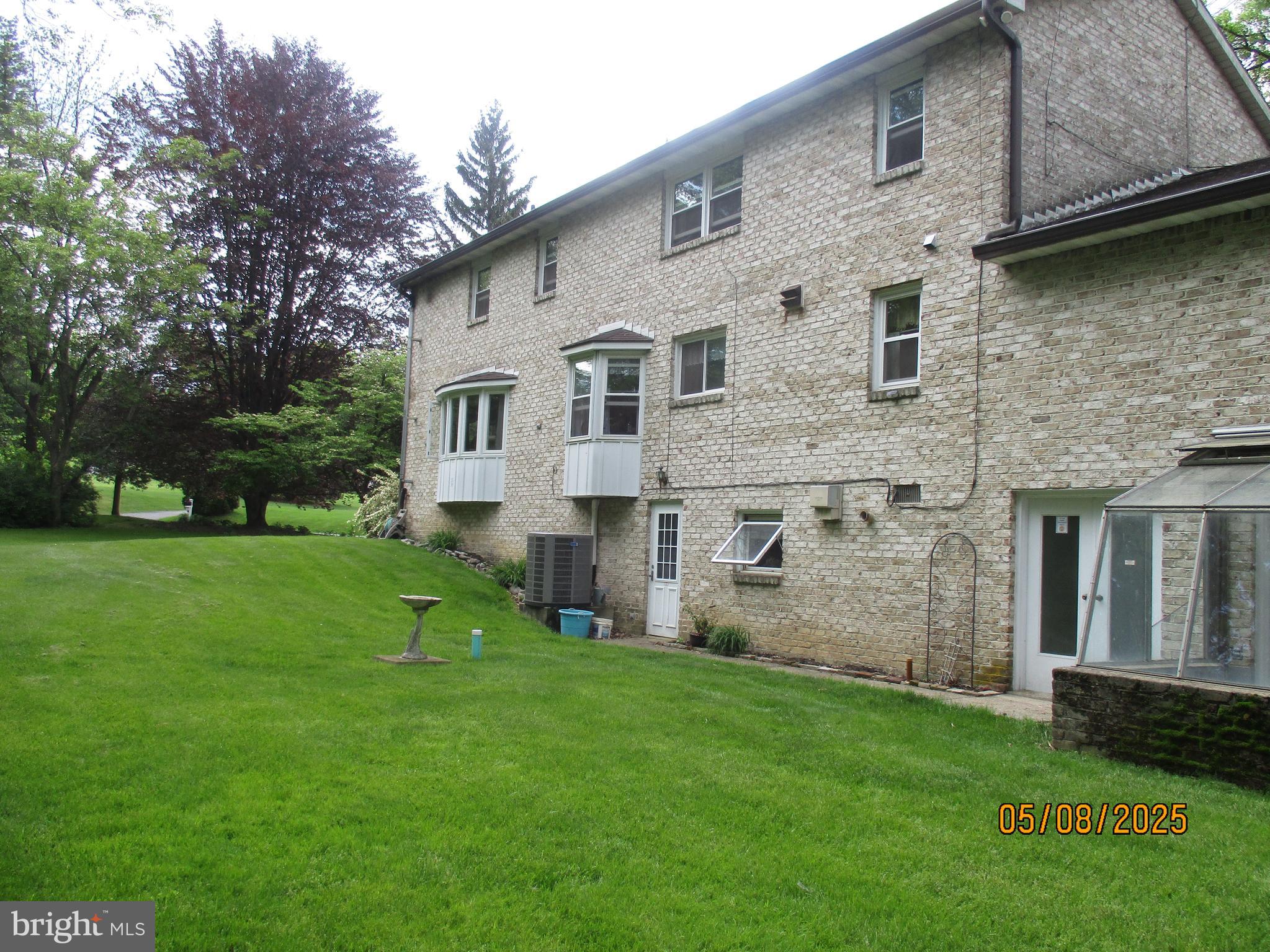9 Montsera Road Carlisle, PA 17015 - Photo 6 of 142 a large brick building with a yard in front of it