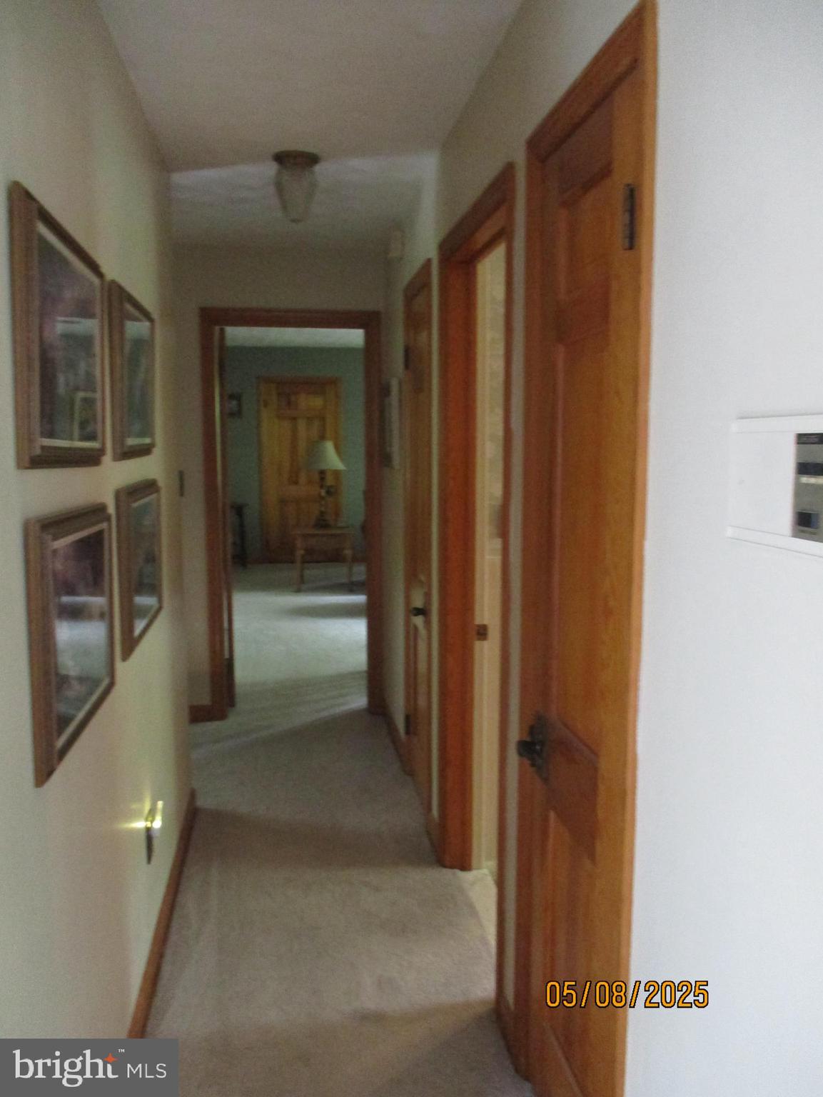 9 Montsera Road Carlisle, PA 17015 - Photo 99 of 142 a view of a hallway with wooden floor and a living room