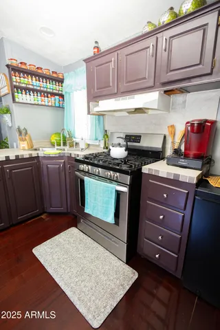 a kitchen with a refrigerator and a sink