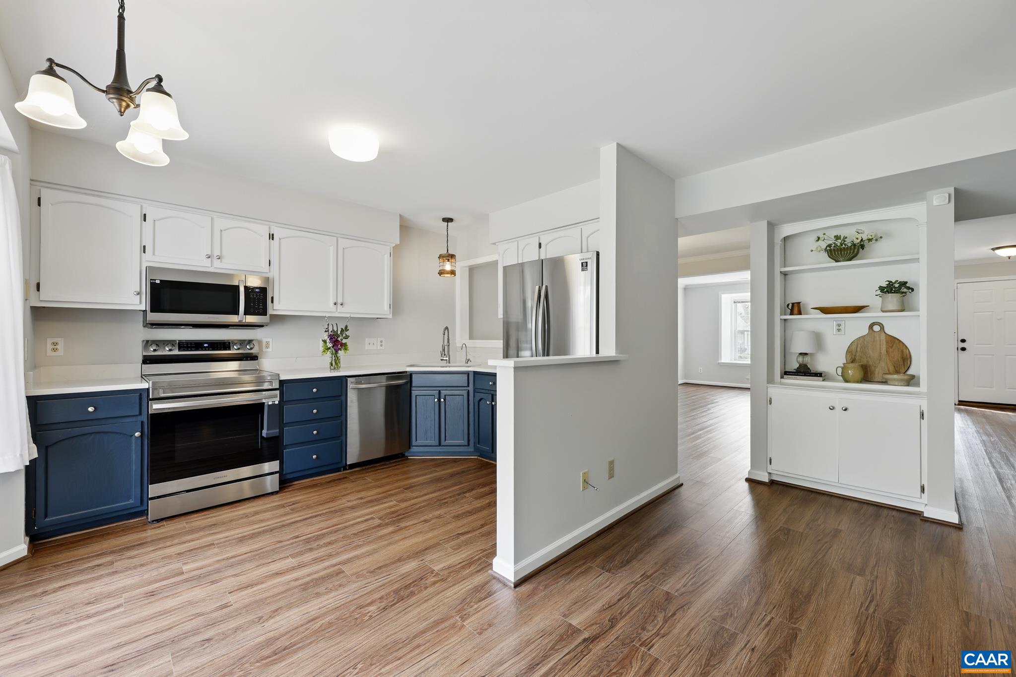 3241 Gateway Circle Charlottesville, VA 22911 - Photo 15 of 35 a kitchen with stainless steel appliances kitchen island granite countertop a stove a sink and a refrigerator