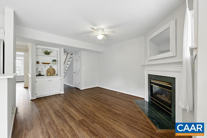 3241 Gateway Circle Charlottesville, VA 22911 - Photo 19 of 35 a workspace with wooden floor fireplace and windows