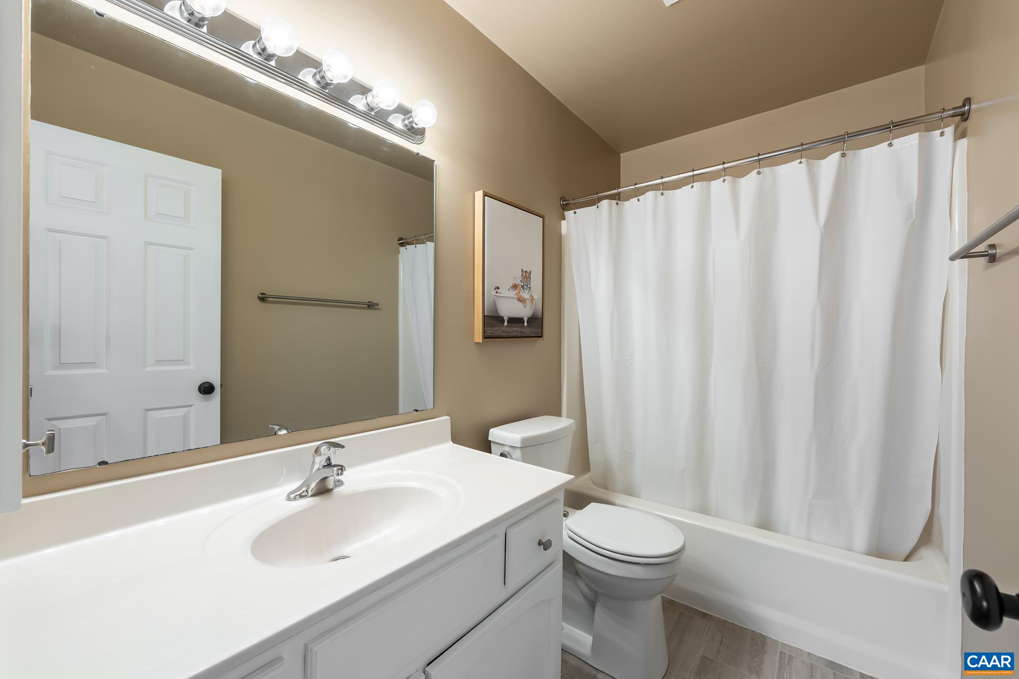 3241 Gateway Circle Charlottesville, VA 22911 - Photo 26 of 35 a bathroom with a sink a toilet and shower curtain