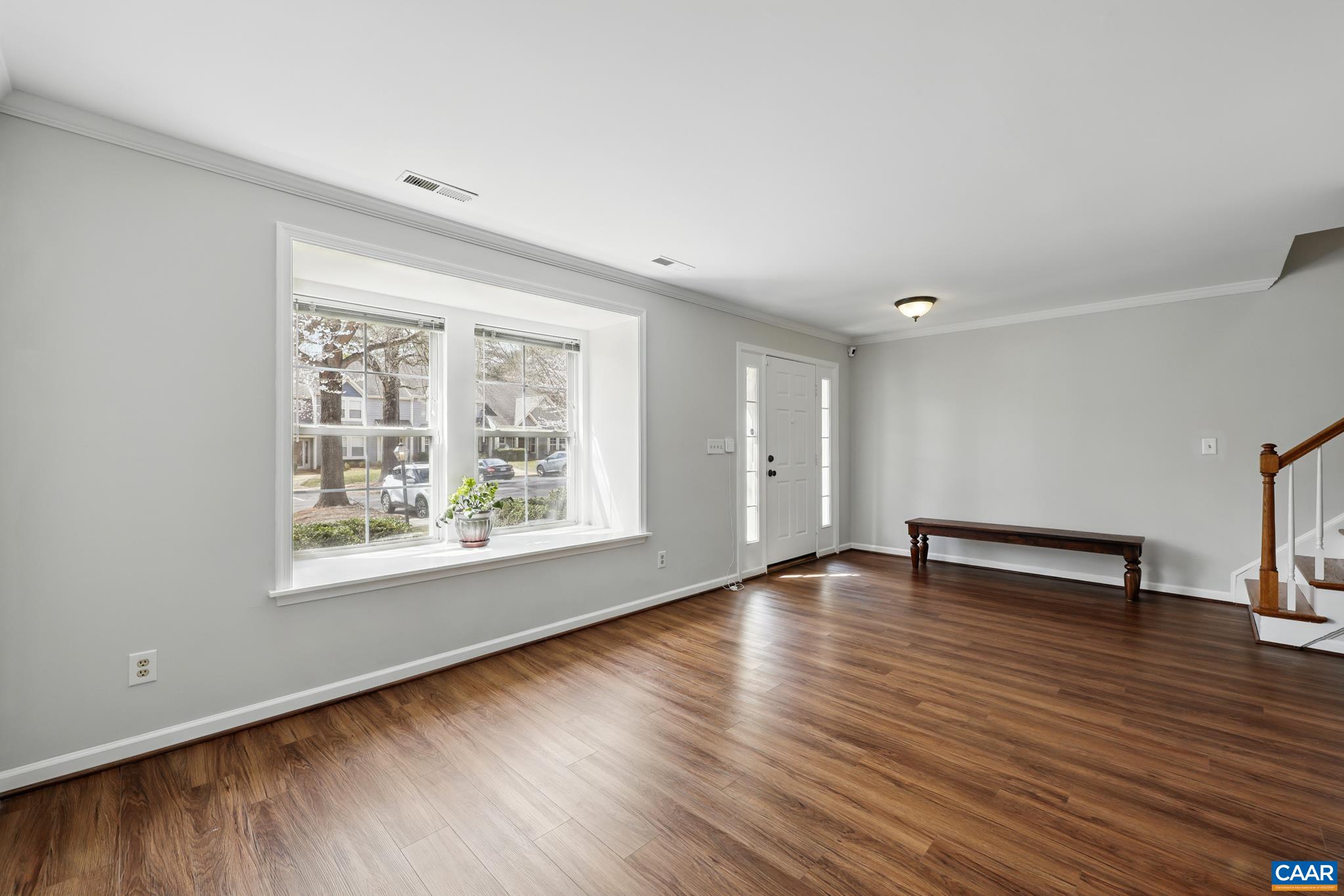 3241 Gateway Circle Charlottesville, VA 22911 - Photo 7 of 35 a view of an empty room with wooden floor and a window
