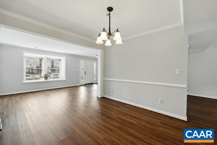 3241 Gateway Circle Charlottesville, VA 22911 - Photo 9 of 35 a view of an empty room with wooden floor and a window