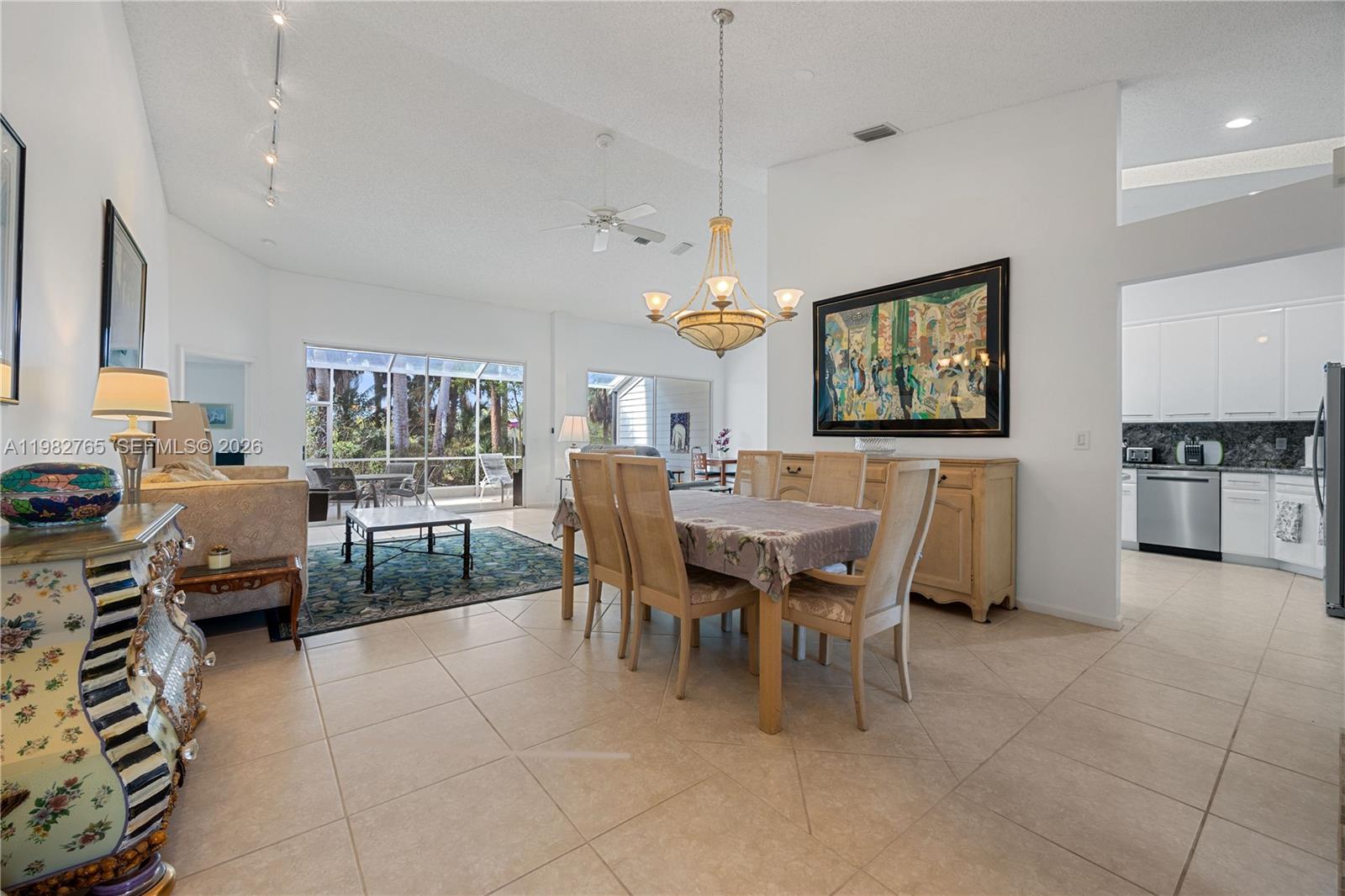 8962 Southeast Riverfront Terrace Jupiter, FL 33469 - Photo 4 of 20 a view of a dining room with furniture