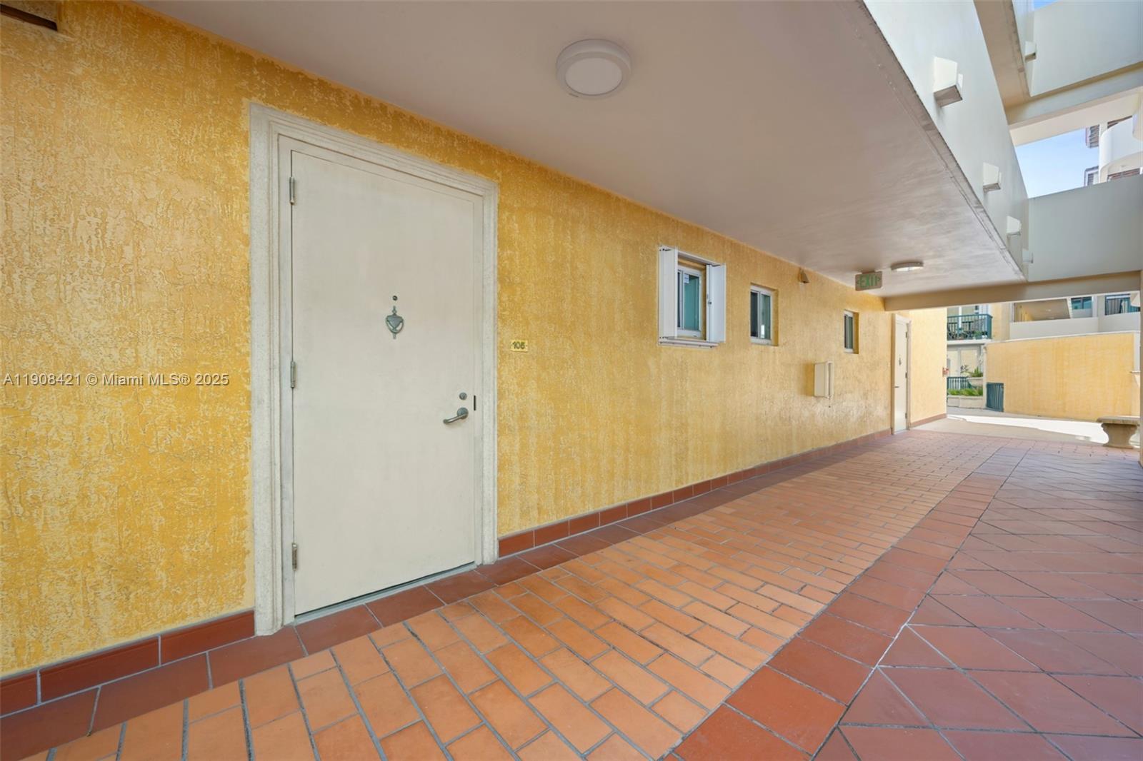 8888 Collins Avenue, Unit 105 Surfside, FL 33154 - Photo 20 of 29 a view of a big room with wooden floor and windows