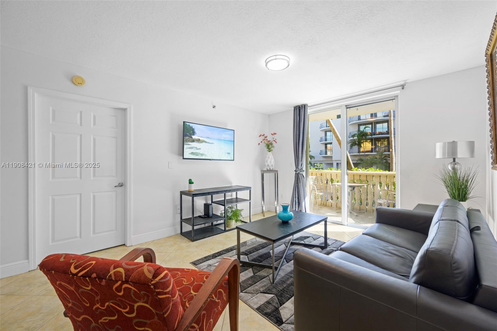 8888 Collins Avenue, Unit 105 Surfside, FL 33154 - Photo 2 of 29 a living room with furniture and a window
