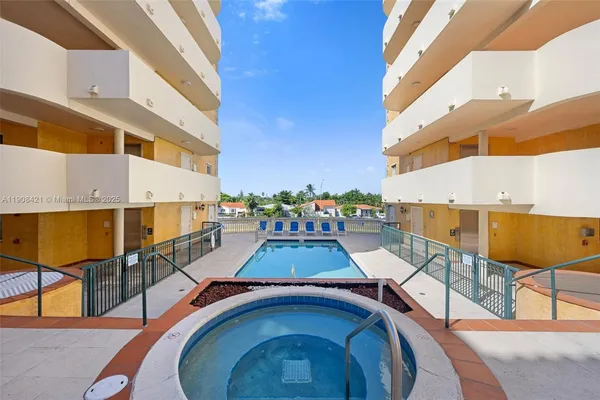 a view of a swimming pool with a lounge chairs