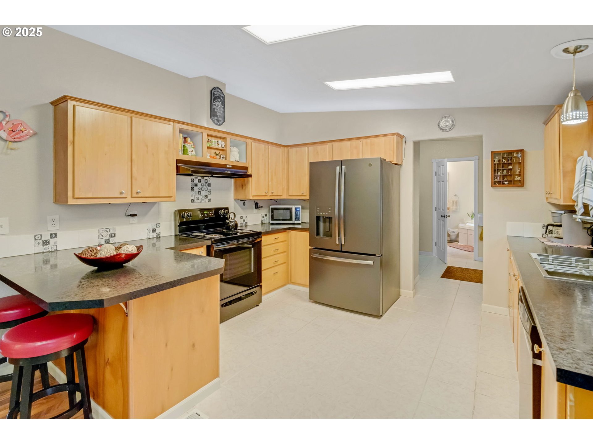 171 Car Road Longview, WA 98632 - Photo 13 of 45 a kitchen with a refrigerator sink and wooden cabinets