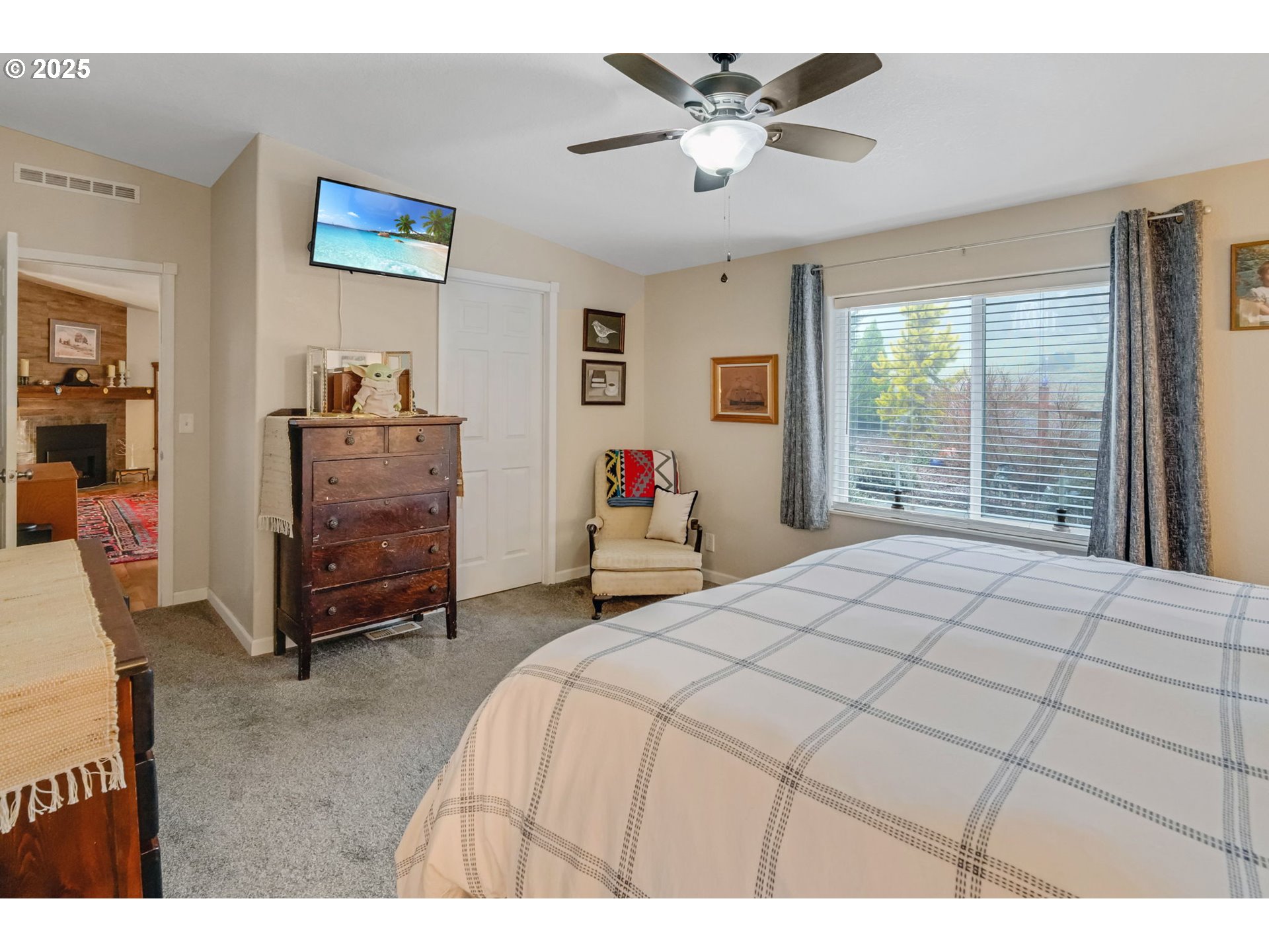 171 Car Road Longview, WA 98632 - Photo 18 of 45 a bedroom with a bed and a chandelier
