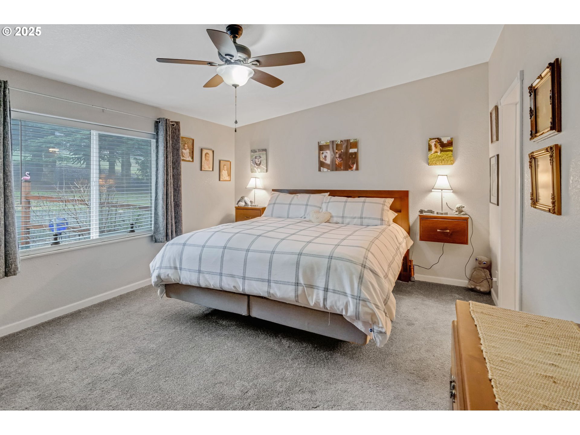171 Car Road Longview, WA 98632 - Photo 19 of 45 a bedroom with a large bed and a chandelier