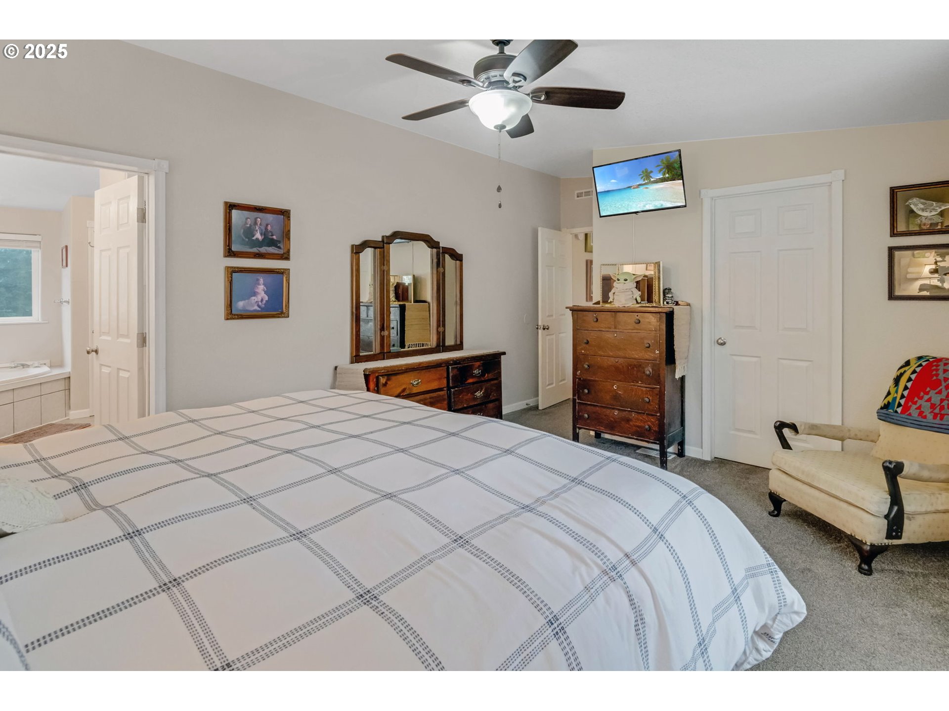 171 Car Road Longview, WA 98632 - Photo 20 of 45 a bedroom with a bed and a chandelier